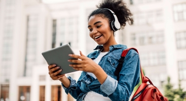 Student talking into iPad