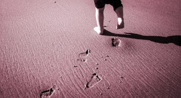 Child's footprints in sand